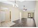 Open-concept living room with vaulted ceilings, tile flooring, and natural light, creating a welcoming space at 205 Hill St # 205, Casselberry, FL 32707