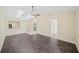 Spacious living room with dark tile flooring and a view of the adjacent rooms at 205 Hill St # 205, Casselberry, FL 32707
