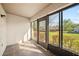 Enclosed back patio featuring tile flooring and sliding glass doors offering serene backyard views at 205 Hill St # 205, Casselberry, FL 32707