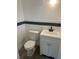 Compact half bathroom featuring a new toilet, sink, vanity, and laminate flooring at 211 Cadillac Ct, Altamonte Springs, FL 32701
