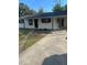 Charming single-story home with a freshly painted exterior and a concrete driveway at 211 Cadillac Ct, Altamonte Springs, FL 32701