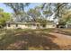 Expansive backyard featuring a shed, covered parking, and ample space for recreation and relaxation at 2204 Votaw Rd, Apopka, FL 32703