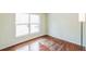 Bedroom with hardwood floors and large window at 2204 Votaw Rd, Apopka, FL 32703
