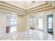 Open living space with high ceilings, tile flooring, and views to the living and dining area at 2204 Votaw Rd, Apopka, FL 32703