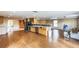 Open concept living space with kitchen, ceiling fan, and laminate floors at 2204 Votaw Rd, Apopka, FL 32703