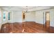 Bright, spacious living room with hardwood floors and modern chandelier at 2204 Votaw Rd, Apopka, FL 32703