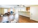 Large living room space with laminate flooring and natural light at 2204 Votaw Rd, Apopka, FL 32703