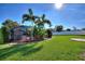 Expansive backyard with lush lawn, privacy fence, and a screened-in pool area at 222 Via Mariel E Dr, Davenport, FL 33896