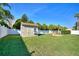 Well-maintained backyard featuring a storage shed and a circular patio area at 222 Via Mariel E Dr, Davenport, FL 33896