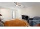 Comfortable bedroom with ceiling fan, neutral walls, and ample natural light at 222 Via Mariel E Dr, Davenport, FL 33896