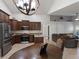 Open kitchen with stainless steel appliances, granite counters, and a view to the Gathering room at 222 Via Mariel E Dr, Davenport, FL 33896