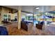 Covered patio with outdoor seating, barbecue grill, and view of the pool area and yard at 222 Via Mariel E Dr, Davenport, FL 33896