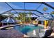 Outdoor screened-in pool area with lounge furnishings, umbrellas, and tropical landscaping at 222 Via Mariel E Dr, Davenport, FL 33896