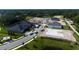 Community aerial view featuring new home construction, green spaces, and a pond at 2430 Francisco Art Ct, Oviedo, FL 32765