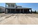 Home featuring a spacious backyard with a covered patio and second story balcony at 2430 Francisco Art Ct, Oviedo, FL 32765