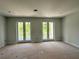 Well-lit bedroom with double doors leading to a private balcony at 2430 Francisco Art Ct, Oviedo, FL 32765