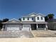 Beautiful two story home with a three-car garage and paved driveway at 2430 Francisco Art Ct, Oviedo, FL 32765