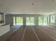 Spacious living room with multiple glass doors offering backyard views at 2430 Francisco Art Ct, Oviedo, FL 32765