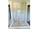Modern walk-in shower featuring decorative tile work and built-in shelves at 2430 Francisco Art Ct, Oviedo, FL 32765