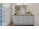 Bright bathroom featuring a double vanity, contemporary fixtures, and modern decor at 2911 Moulin Rd, Davenport, FL 33837
