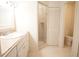 Bathroom features a vanity with countertop, a walk-in shower, and tiled flooring at 2936 Antique Oaks Cir # 71, Winter Park, FL 32792