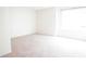 Bright bedroom featuring neutral carpet, a large window, and ample natural light at 2936 Antique Oaks Cir # 71, Winter Park, FL 32792