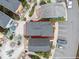 Aerial view of the property with a red outline; parking, landscaping, and nearby houses at 3095 Key Lime Loop, Kissimmee, FL 34747