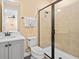 Bathroom with shower, toilet, and vanity with sink; great lighting and fresh towels at 3095 Key Lime Loop, Kissimmee, FL 34747