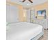 Bright bedroom with a TV, closet, and a view of the upstairs landing area at 3095 Key Lime Loop, Kissimmee, FL 34747