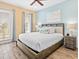 Serene bedroom featuring a plush king-size bed, stylish nightstands, and natural light enhancing the relaxing atmosphere at 3095 Key Lime Loop, Kissimmee, FL 34747
