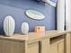 Close-up of living room decor, with surfboard art and coastal-themed accents at 3095 Key Lime Loop, Kissimmee, FL 34747