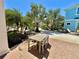 Outdoor brick patio with a table and four chairs, perfect for backyard enjoyment at 3095 Key Lime Loop, Kissimmee, FL 34747