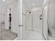 Bathroom featuring a modern glass enclosed shower with marble tile and updated fixtures at 3252 Jackson Bluff Way, Clermont, FL 34711