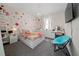 Bright bedroom features vibrant wallpaper, a chandelier, and a makeup vanity at 3252 Jackson Bluff Way, Clermont, FL 34711