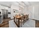 Bright dining room features modern chandelier, wood table, and stylish decor at 3252 Jackson Bluff Way, Clermont, FL 34711