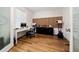 Dedicated office space with wood floors, modern desk, and stylish accent wall at 3252 Jackson Bluff Way, Clermont, FL 34711