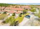 Overhead view of townhomes boasting well-maintained lawns and convenient parking at 3621 Casello Dr, New Smyrna Beach, FL 32168