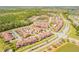 Expansive aerial view featuring a residential area, ponds, and nature preserves at 3621 Casello Dr, New Smyrna Beach, FL 32168