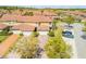 Aerial view of townhomes with well-kept lawns, brick driveways and mature trees at 3621 Casello Dr, New Smyrna Beach, FL 32168