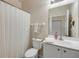 Bathroom with a shower, a toilet, and a single sink vanity at 3621 Casello Dr, New Smyrna Beach, FL 32168