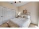 Cozy bedroom with a queen-size bed, neutral colors, and a closet at 3621 Casello Dr, New Smyrna Beach, FL 32168