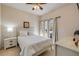 Comfortable bedroom with neutral colors, natural light, and ceiling fan at 3621 Casello Dr, New Smyrna Beach, FL 32168