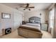Comfortable bedroom featuring a ceiling fan, neutral walls, and comfortable furnishings at 3621 Casello Dr, New Smyrna Beach, FL 32168