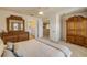 Bedroom featuring a dresser and door to the en-suite bathroom, and a neutral, relaxing color scheme at 3621 Casello Dr, New Smyrna Beach, FL 32168