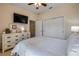 Bright bedroom with neutral colors, ceiling fan, and closet at 3621 Casello Dr, New Smyrna Beach, FL 32168
