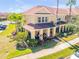 Beautiful two-story townhome with vibrant landscaping and a welcoming facade at 3621 Casello Dr, New Smyrna Beach, FL 32168