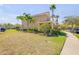 Lovely townhome featuring well-kept landscaping and a sidewalk at 3621 Casello Dr, New Smyrna Beach, FL 32168
