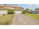 Charming townhome with a brick driveway, well-manicured landscaping, and an attached two-car garage at 3621 Casello Dr, New Smyrna Beach, FL 32168