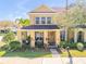 Attractive exterior with a covered porch, verdant landscaping, and well-maintained lawn at 3621 Casello Dr, New Smyrna Beach, FL 32168