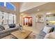 Inviting living room with high ceilings, sofa, and view into the dining and kitchen areas at 3621 Casello Dr, New Smyrna Beach, FL 32168